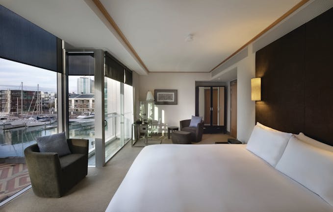 Sofitel Viaduct Auckland Harbour marina room bedroom with floor to ceiling windows and marina view
