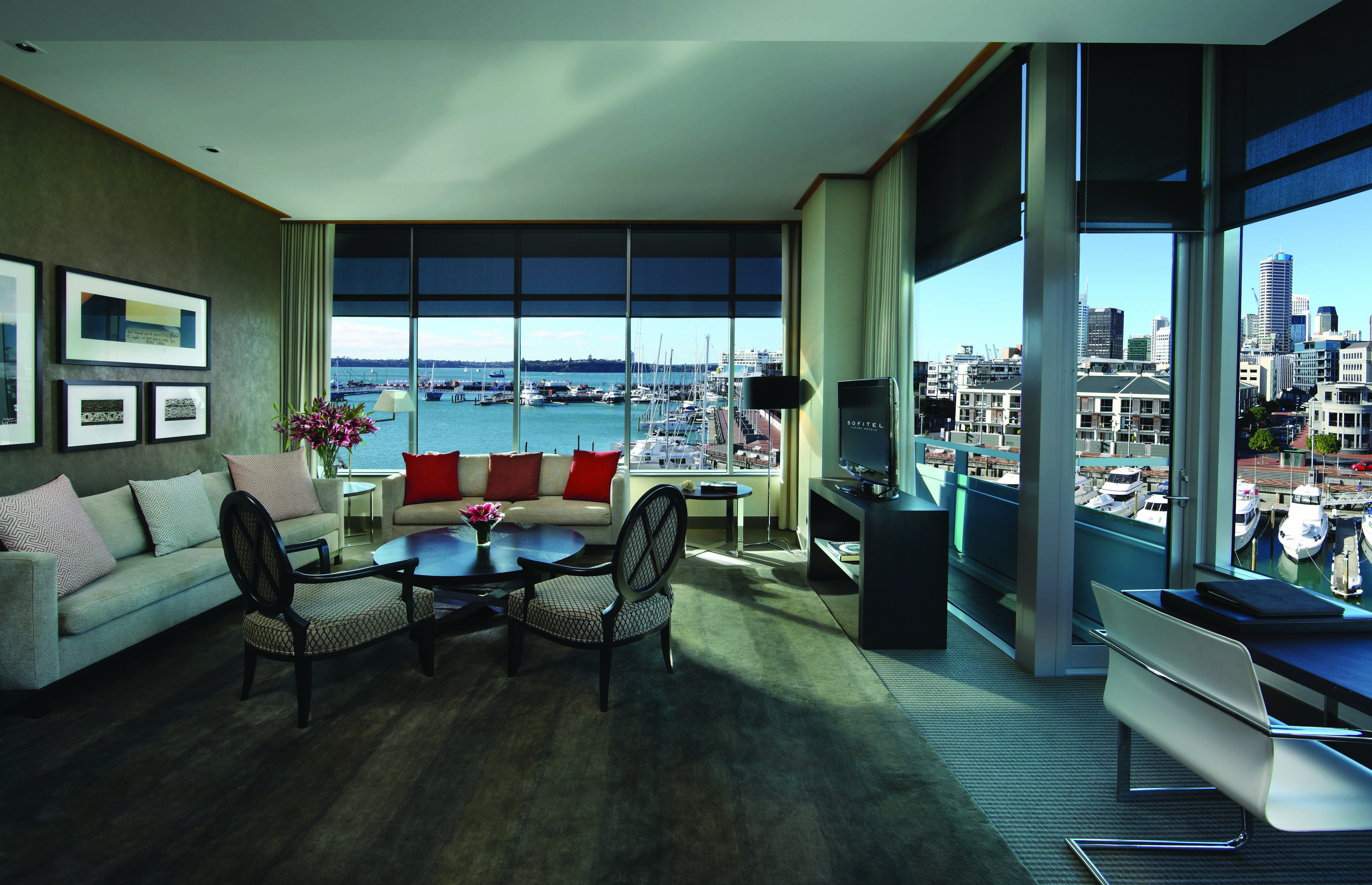 Sofitel Viaduct Auckland Harbour prestige lounge with sofas and chairs and marina view