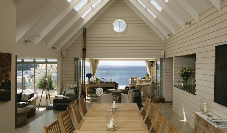 The Boatshed Waiheke Island Auckland dining room with patio and  beach access