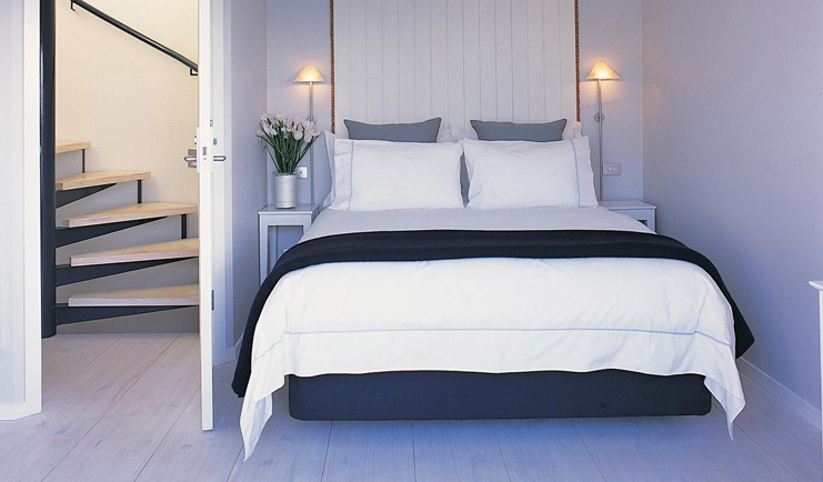 The Boatshed Waiheke Island Auckland lighthouse bedroom with spiral staircase