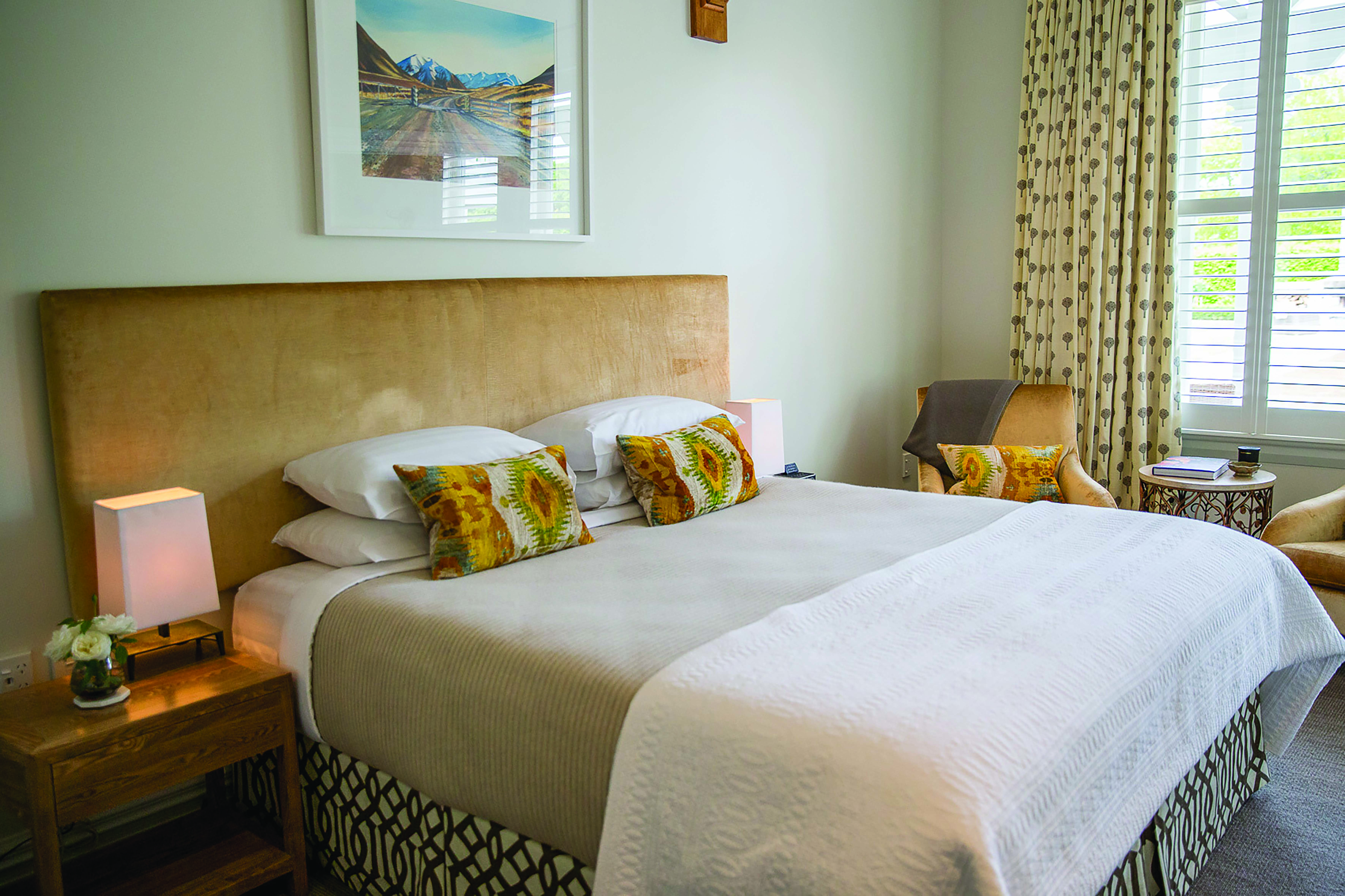 Marlborough Lodge Blenheim and Marlborough bedroom with two armchairs