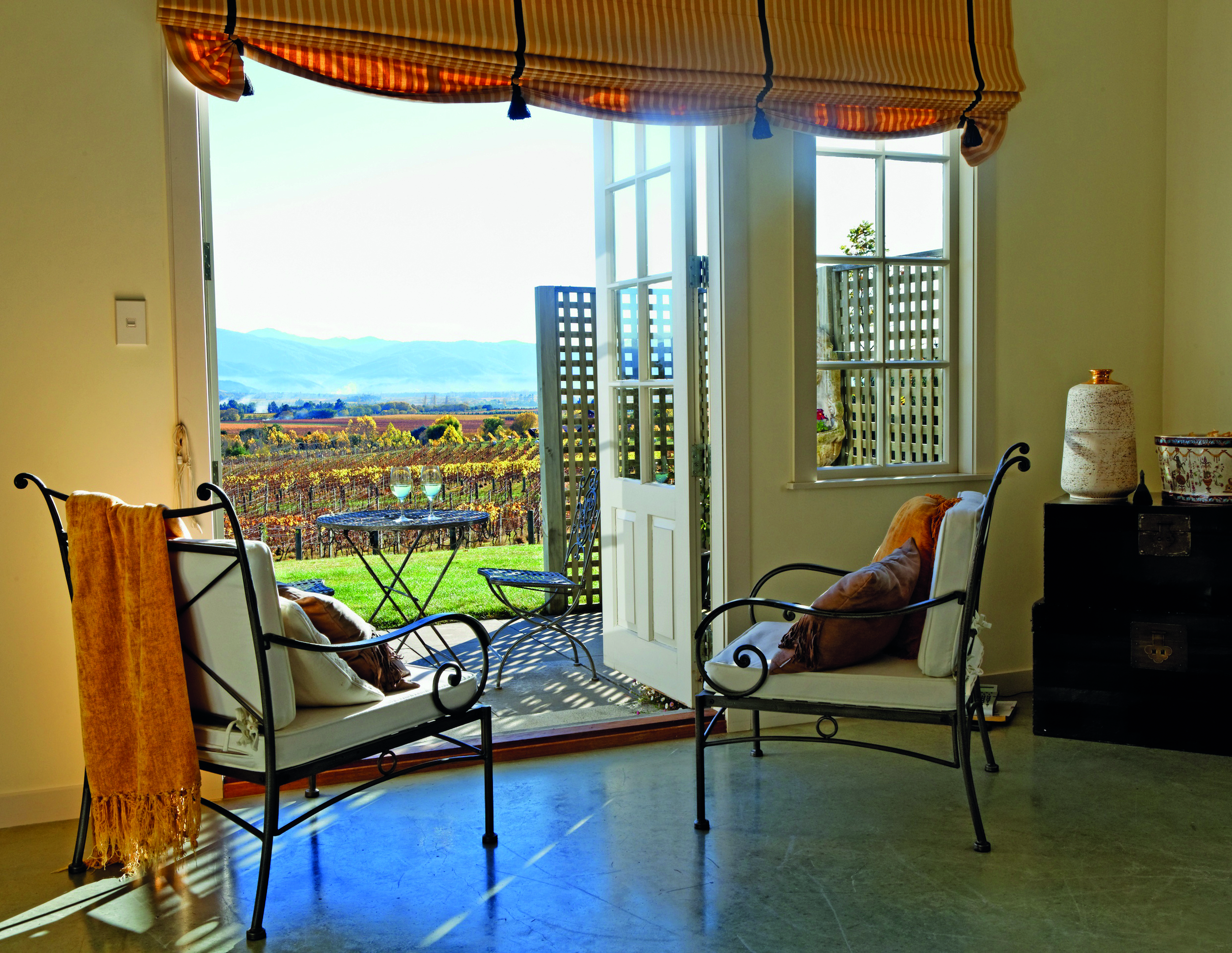 The Bell Tower on Dog Point Blenheim and Marlborough Highfield courtyard two chairs looking out to deck and vineyard