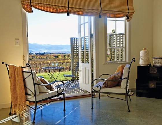 The Bell Tower on Dog Point Blenheim and Marlborough Highfield courtyard two chairs looking out to deck and vineyard