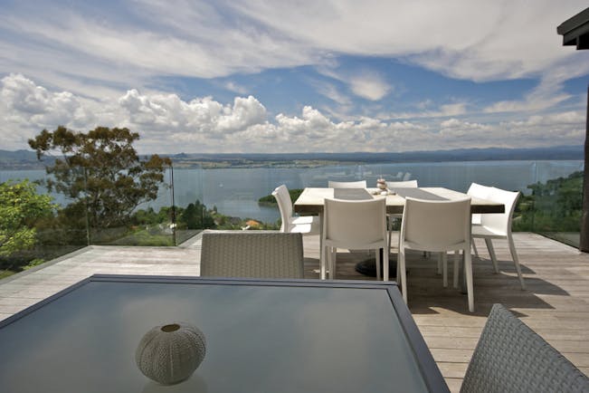 Acacia Cliffs Lodge Central North Island deck seating area with coast view
