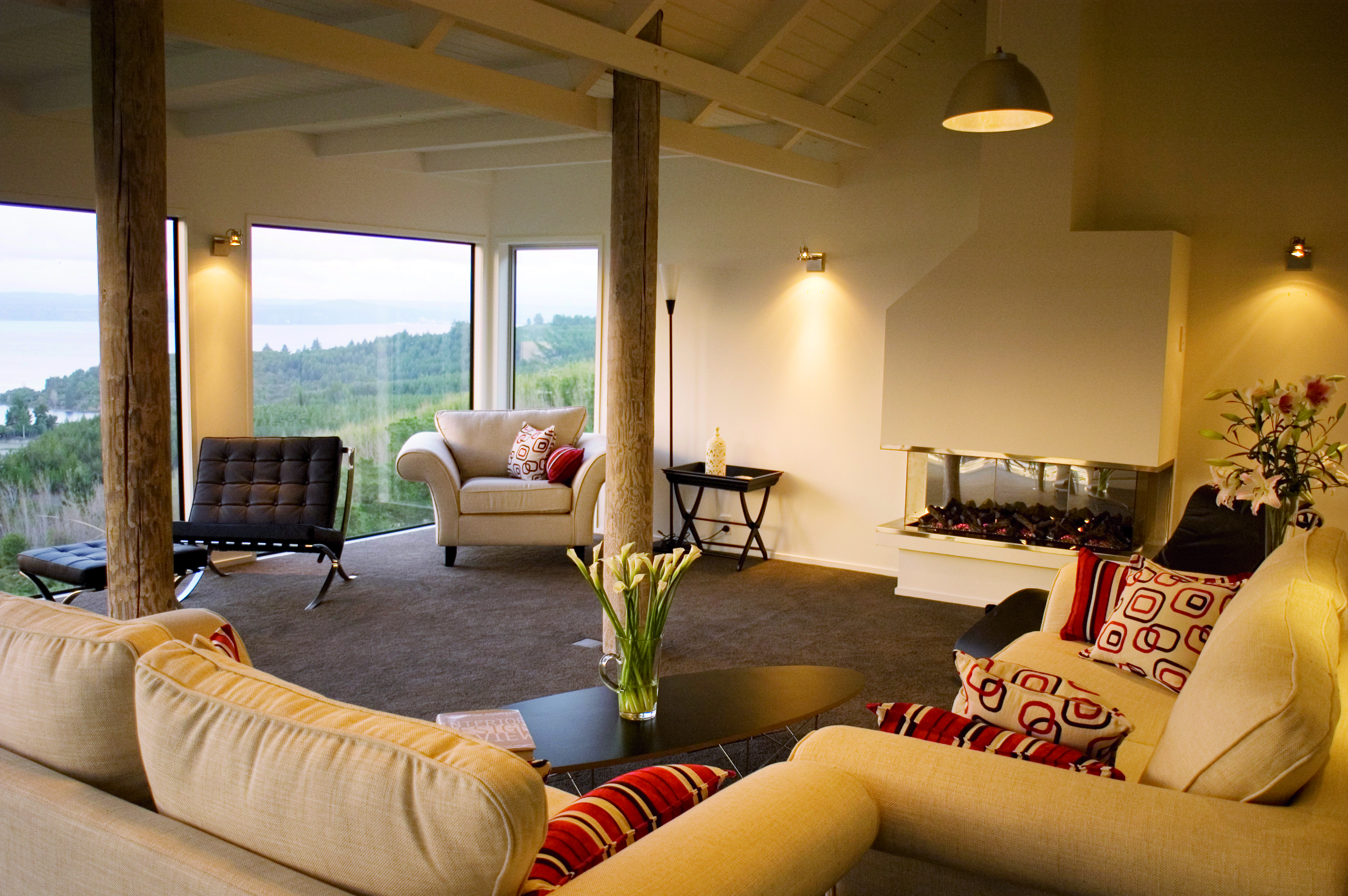 Acacia Cliffs Lodge Central North Island lounge with large windows and coast view