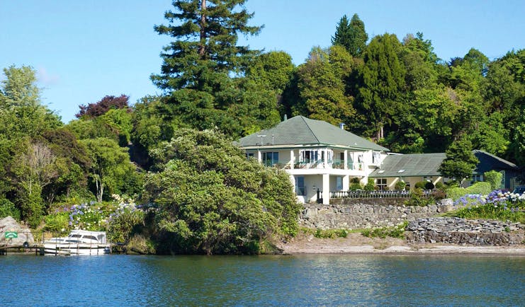 Black Swan Boutique Hotel Central North Island aerial white lodge surrounded by trees overlooking the sea