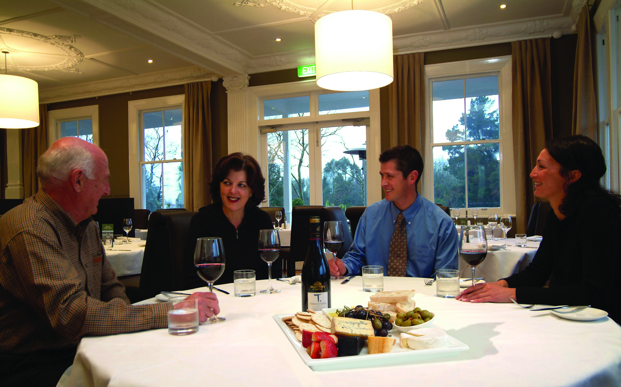The Hilton Lake Taupo Central North Island restaurant people sitting at a table drinking wine
