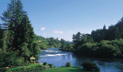 Huka Lodge Central North Island river aerial view of river with wooded banks 