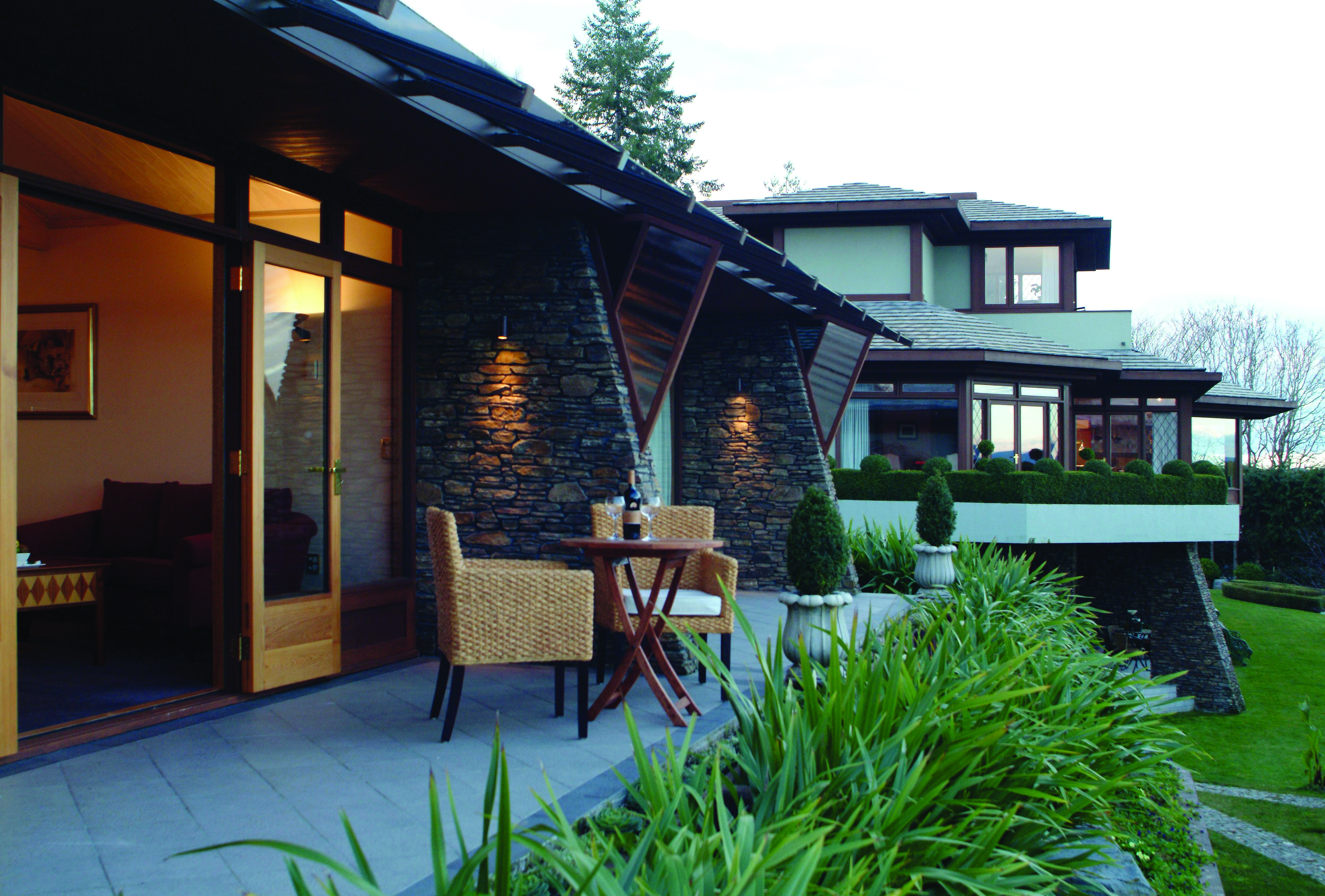 Outside on a balcony with chairs 