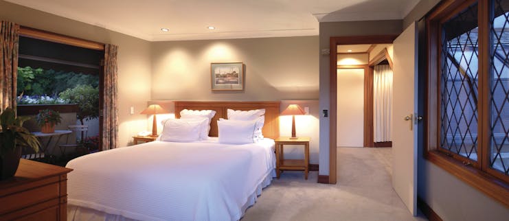 Suite with large double bed, lights, windows and balcony