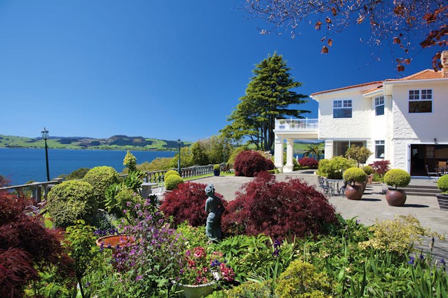 Peppers on the Point Central North Island courtyard white building with gardens and lake view