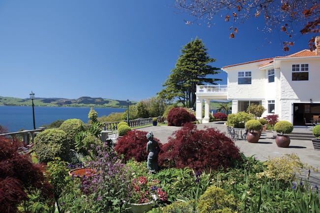 Peppers on the Point Central North Island courtyard white building with gardens and lake view