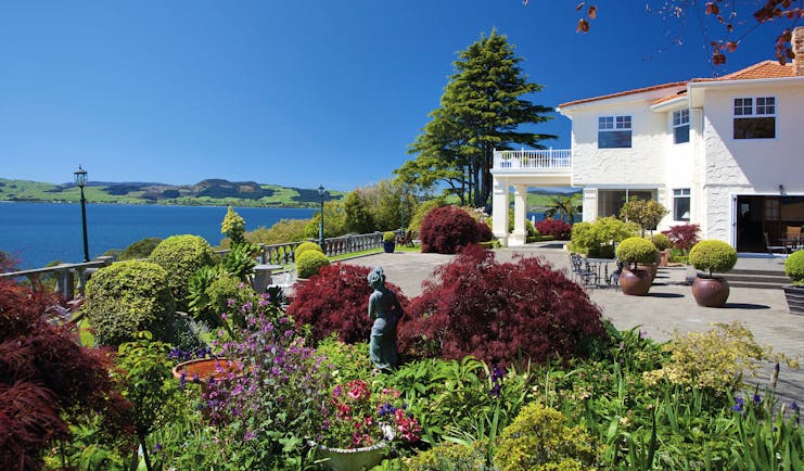 Peppers on the Point Central North Island courtyard white building with gardens and lake view
