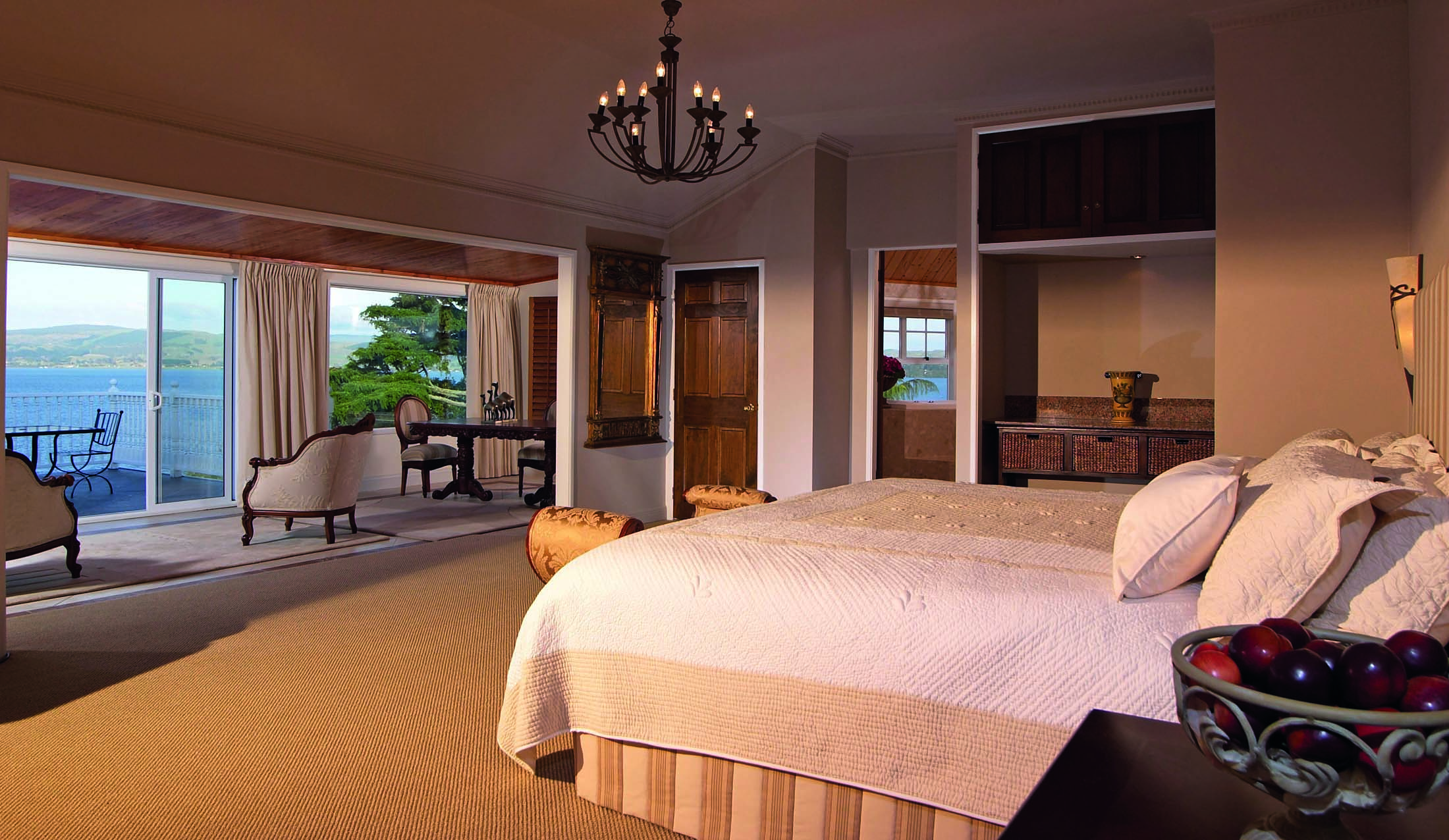 Peppers on the Point Central North Island suite with sitting area and large windows to deck with lake view