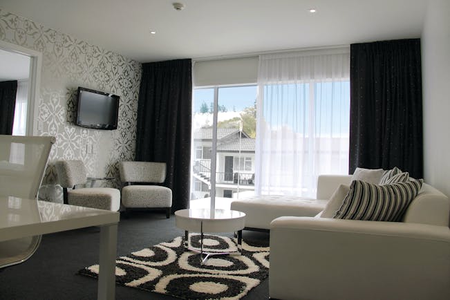 Regent of Rotorua Central North Island lounge with black and white patterned walls and large windows