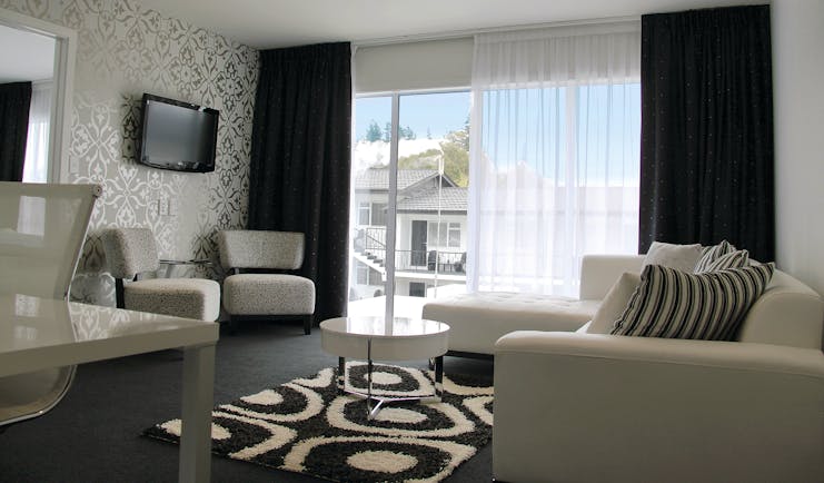 Regent of Rotorua Central North Island lounge with black and white patterned walls and large windows