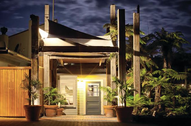 Solitaire Lodge exterior, potted plants, front door