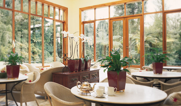 Treetops Lodge Central North Island conservatory dining area 