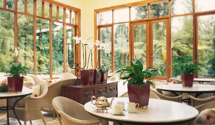 Treetops Lodge Central North Island conservatory dining area 
