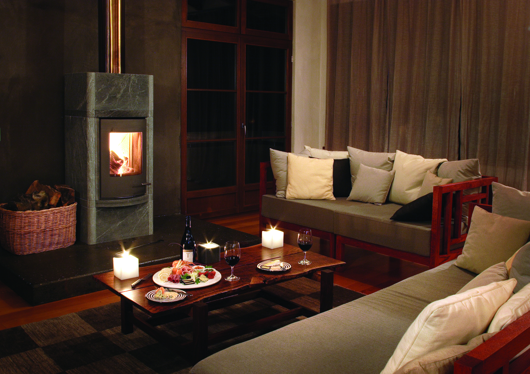 Hapuku Lodge Central South Island lounge area with sofas and fireplace