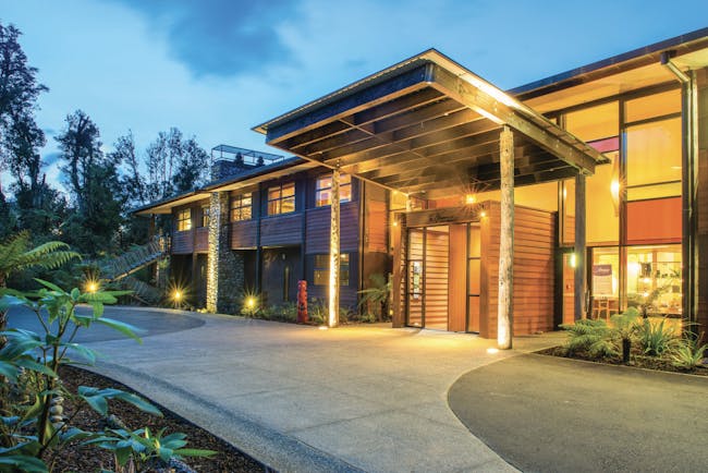 Te Waonui Forest Retreat Central South Island exterior building with large windows and wood facade