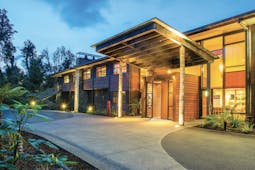 Te Waonui Forest Retreat Central South Island exterior building with large windows and wood facade