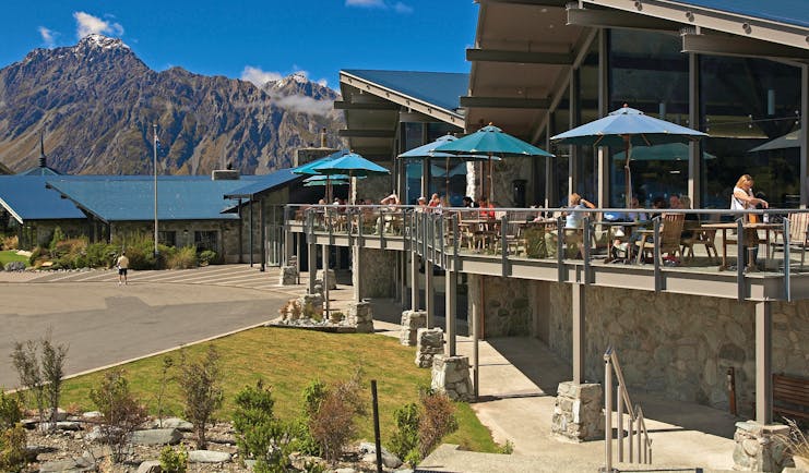 The Hermitage Hotel Central South Island cafe outdoor dining area with umbrellas and mountain view