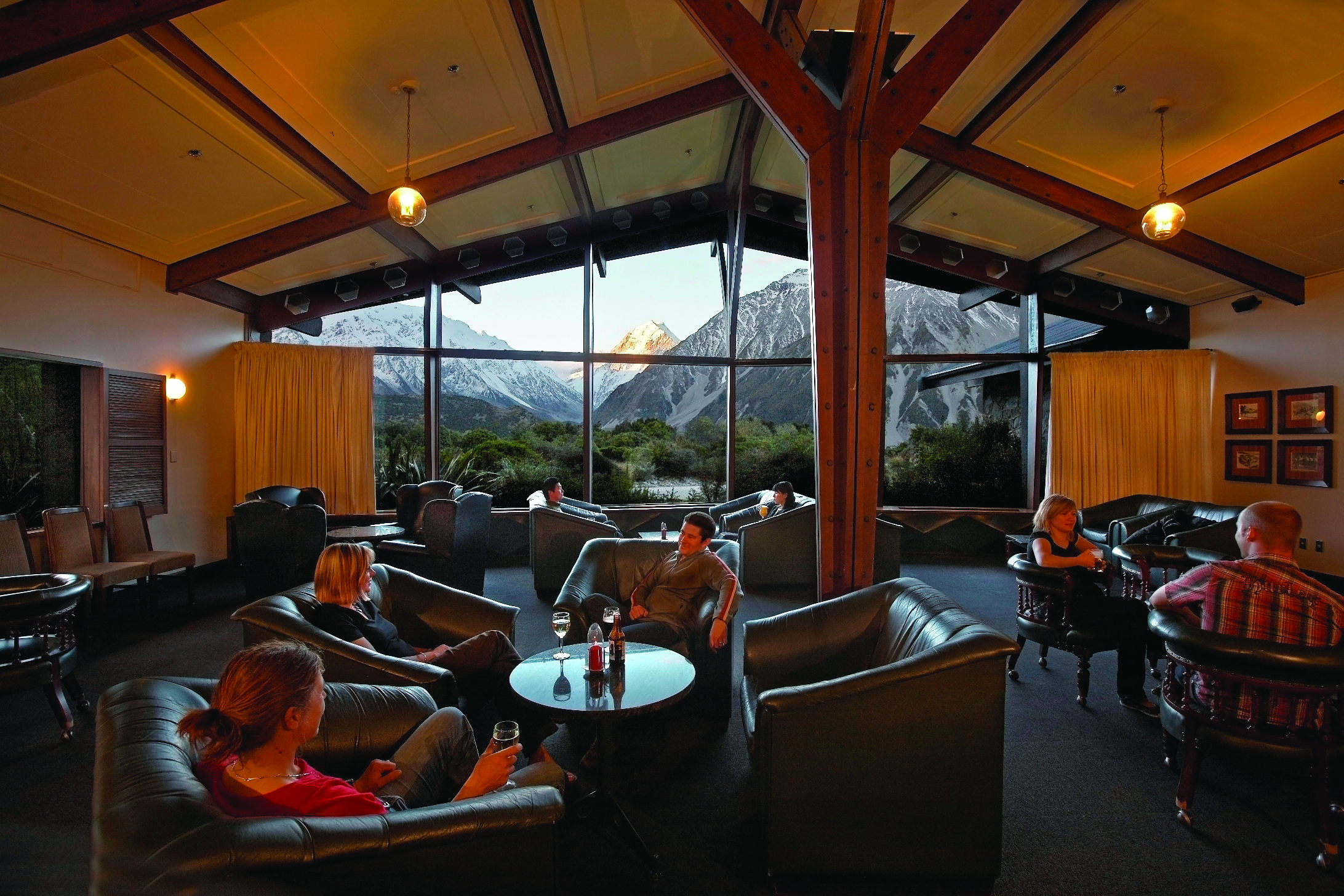The Hermitage Hotel Central South Island lounge with leather seats with panoramic mountain view