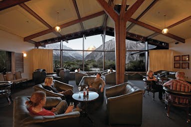 The Hermitage Hotel Central South Island lounge with leather seats with panoramic mountain view