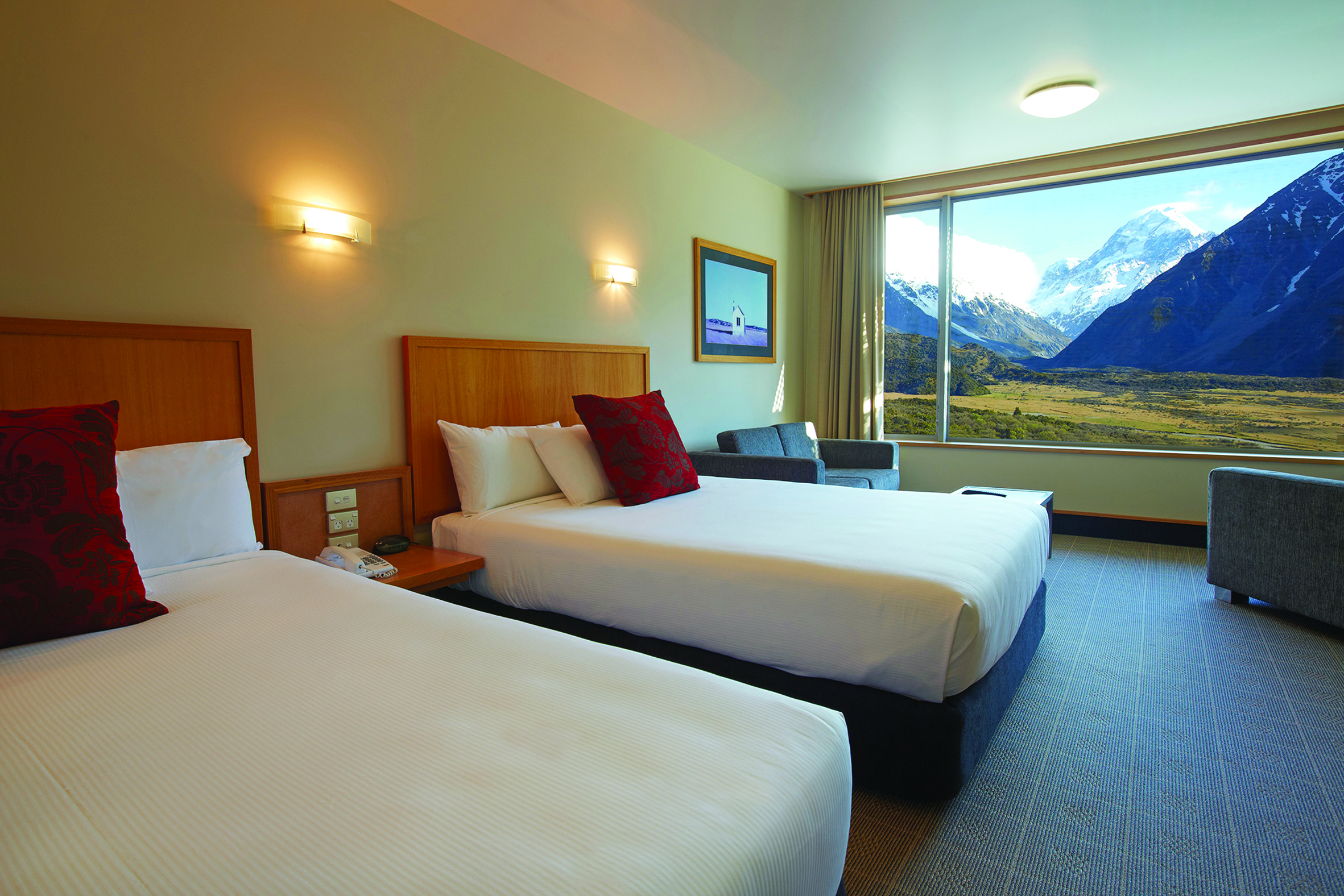 The Hermitage Hotel Central South Island twin bedroom with large window and mountain view