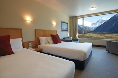 The Hermitage Hotel Central South Island twin bedroom with large window and mountain view