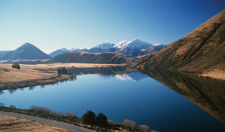 Wilderness Lodge at Nelsons Pass Central South Island lake surrounded by snow capped mountains