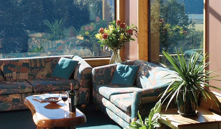 Wilderness Lodge at Nelsons Pass Central South Island lounge with sofas and large windows