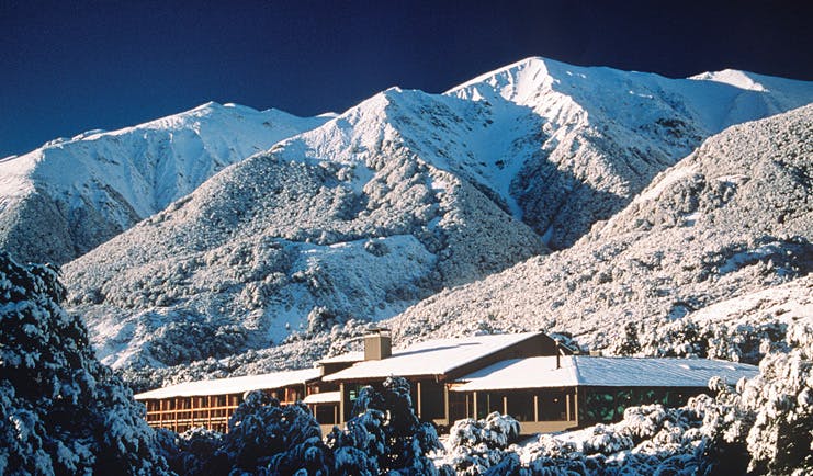 Wilderness Lodge at Nelsons Pass Central South Island mountain lodge overlooked by snowy mountain
