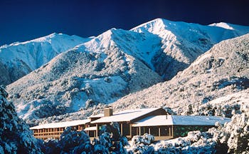 Wilderness Lodge at Nelsons Pass Central South Island mountain lodge overlooked by snowy mountain