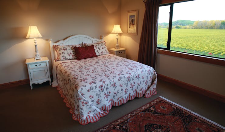 Beckenridge Lodge Hawkes Bay and Napier bedroom with large window and vineyard view
