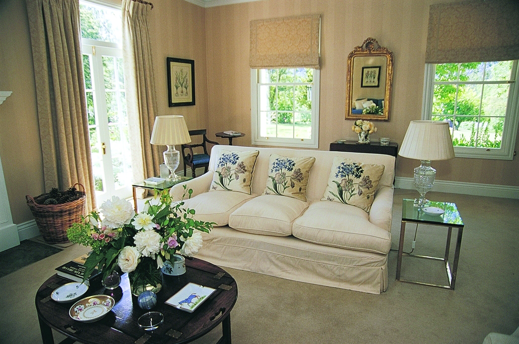 Edenhouse Luxury Lodge Nelson Abel and Tasman lounge area with sofa and flowers