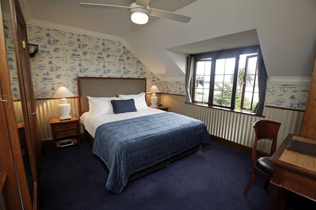 Grand Mercure Nelson Monaco Nelson Abel and Tasman bedroom with blue and white patterned walls and large window