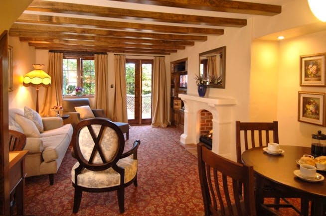 Grand Mercure Nelson Monaco Nelson Abel and Tasman cottage living room with sofa table fireplace and patio doors