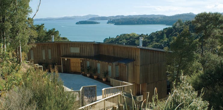 The Sanctuary at Bay of Islands Northlands and Bay of Islands exterior wooden buildings surrounded by trees near coast