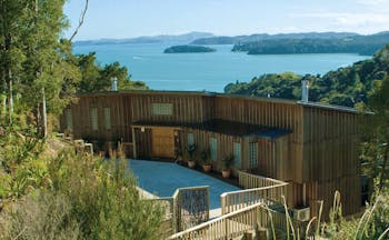 The Sanctuary at Bay of Islands Northlands and Bay of Islands exterior wooden buildings surrounded by trees near coast