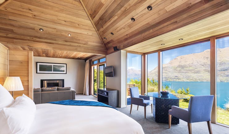 Azur Lodge Otago and Fiordland bedroom with dining and sitting area and mountain view