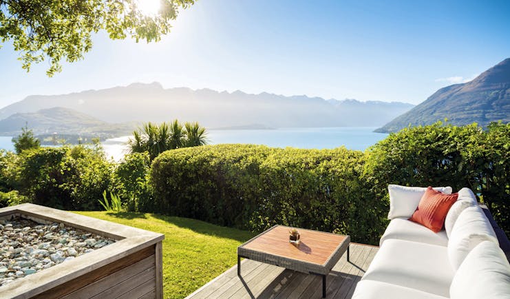 Azur Lodge Otago and Fiordland exterior view sofa in a garden overlooking mountains and water
