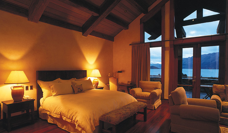 Blanket Bay Otago and Fiordland bedroom with seating area and access to patio