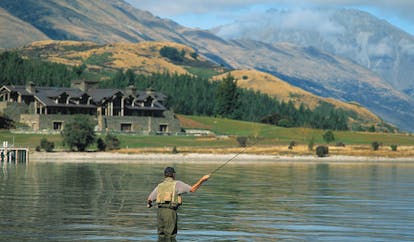 Blanket Bay Otago and Fiordland man fly fishing in a lake