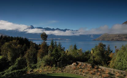 The Hidden Lodge Otago and Fiordland aerial forest view with lake and mountains