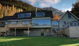 The Hidden Lodge Otago and Fiordland exterior lodge with large windows and balconies