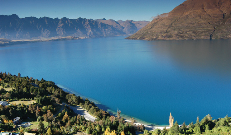 The Hidden Lodge Otago and Fiordland lake surrounded by mountains