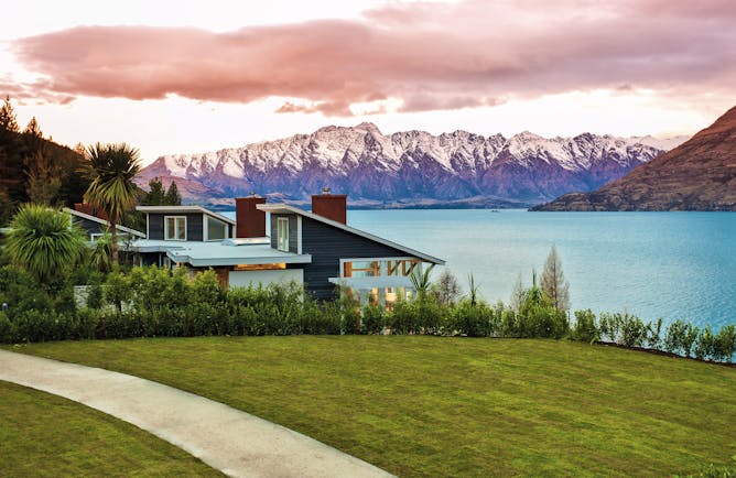 Matakauri Lodge Otago and Fiordland exterior lake wooden chalet with mountain and lake view 