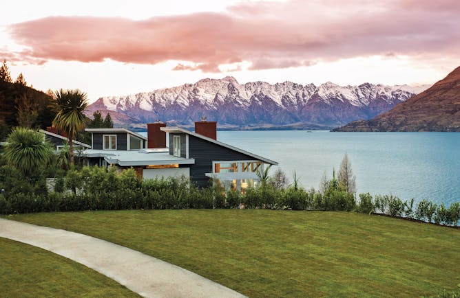 Matakauri Lodge Otago and Fiordland exterior lake wooden chalet with mountain and lake view 